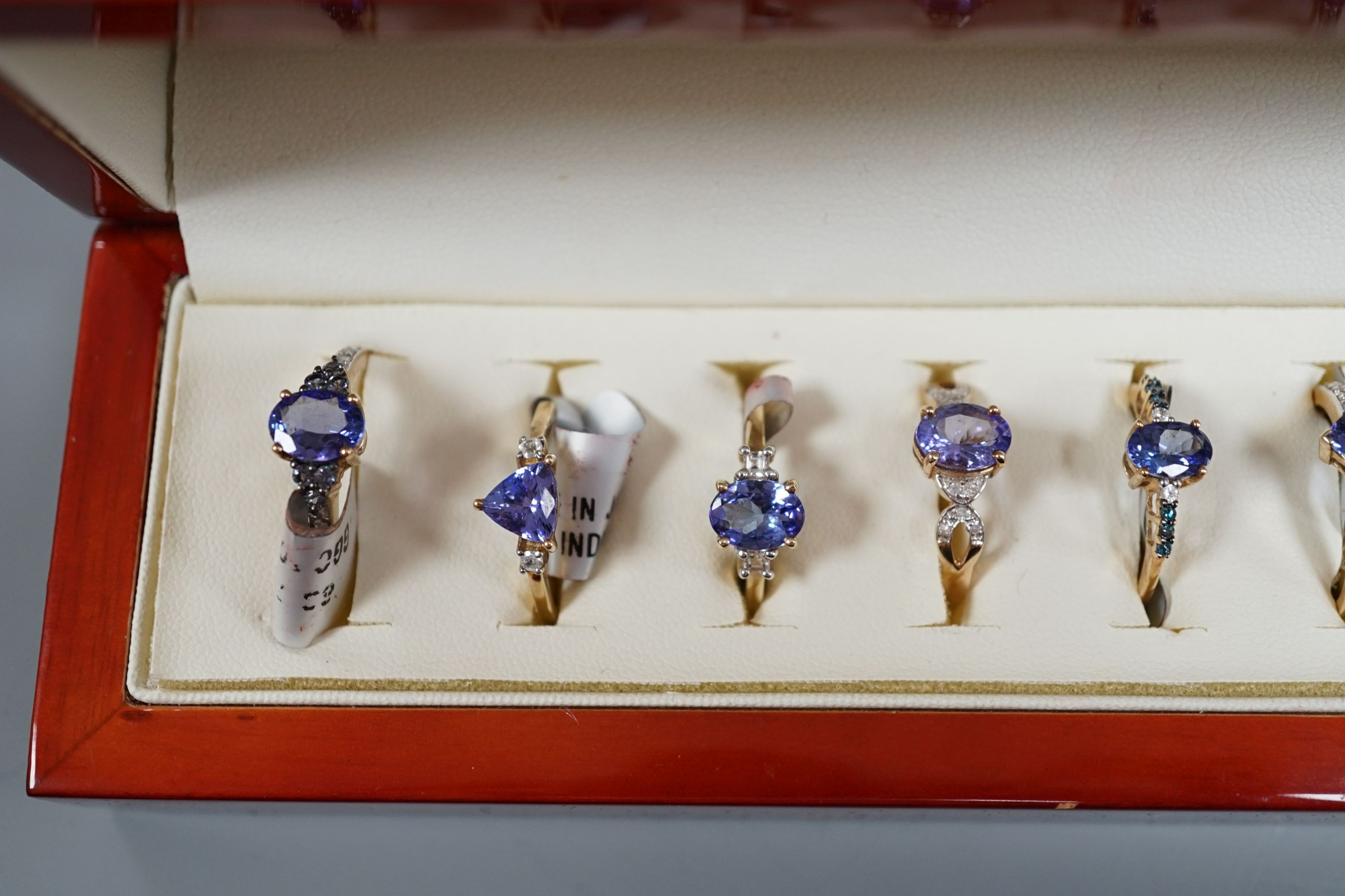 Nine assorted modern 9ct gold and tanzanite dress rings, one similar 14ct gold ring and two 925 and gem set rings